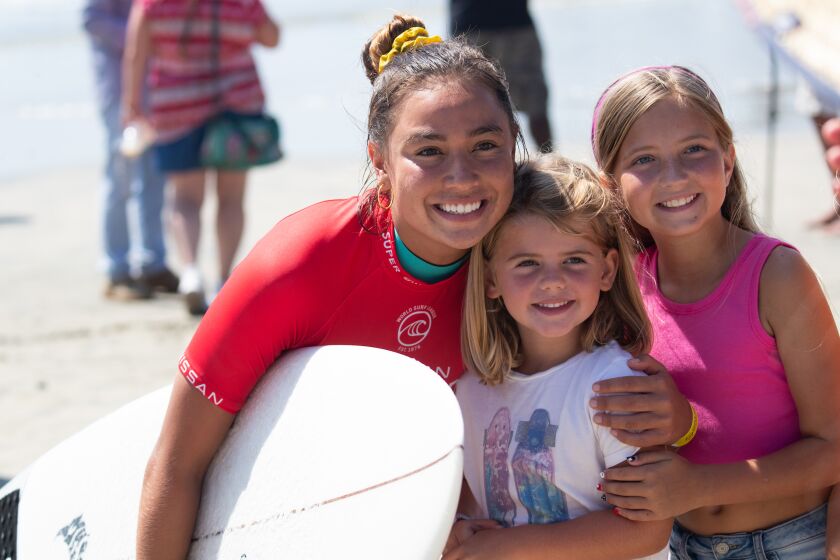 Surfer Tia Blanco with fans.