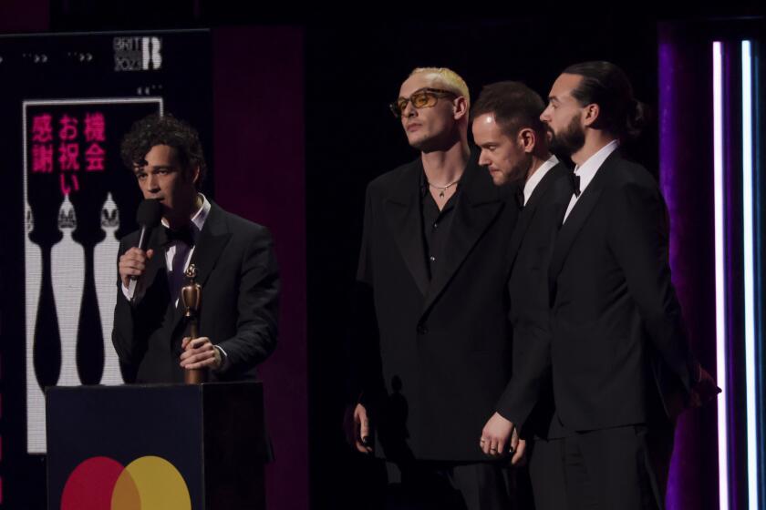 The 1975 on stage accepting the award for Best Rock/Alternative Act at the Brit Awards 2023 in London, Saturday, Feb. 11, 2023. (Photo by Vianney Le Caer/Invision/AP)