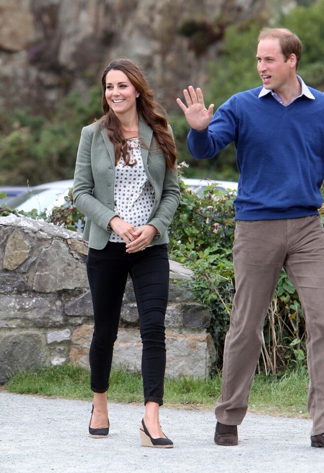 Catherine, Duchess of Cambridge, and Prince William, Duke of Cambridge, attend the start of the Ring O'Fire Anglesey Coastal Ultra Marathon on Aug. 30, 2013, in Holyhead, Wales.