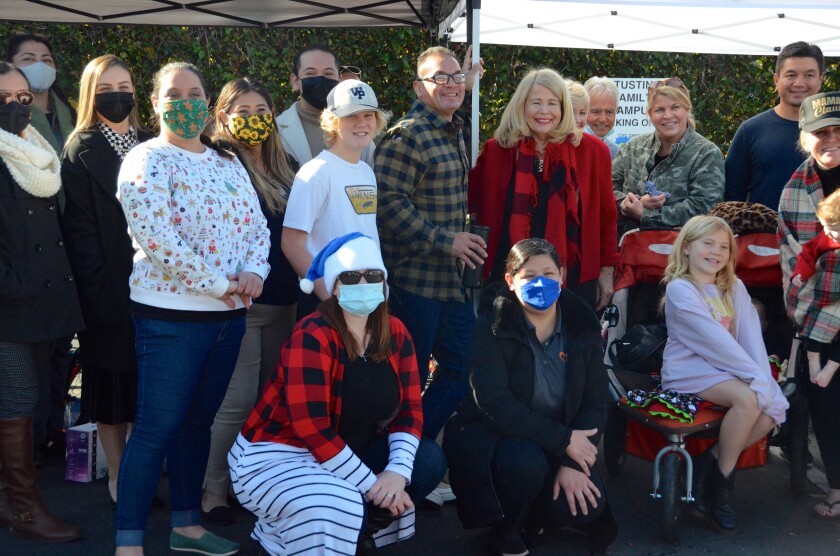 Bicycle Santas, Sean Canova and Trish Hurley, center are surrounded by FRC, friends and family.