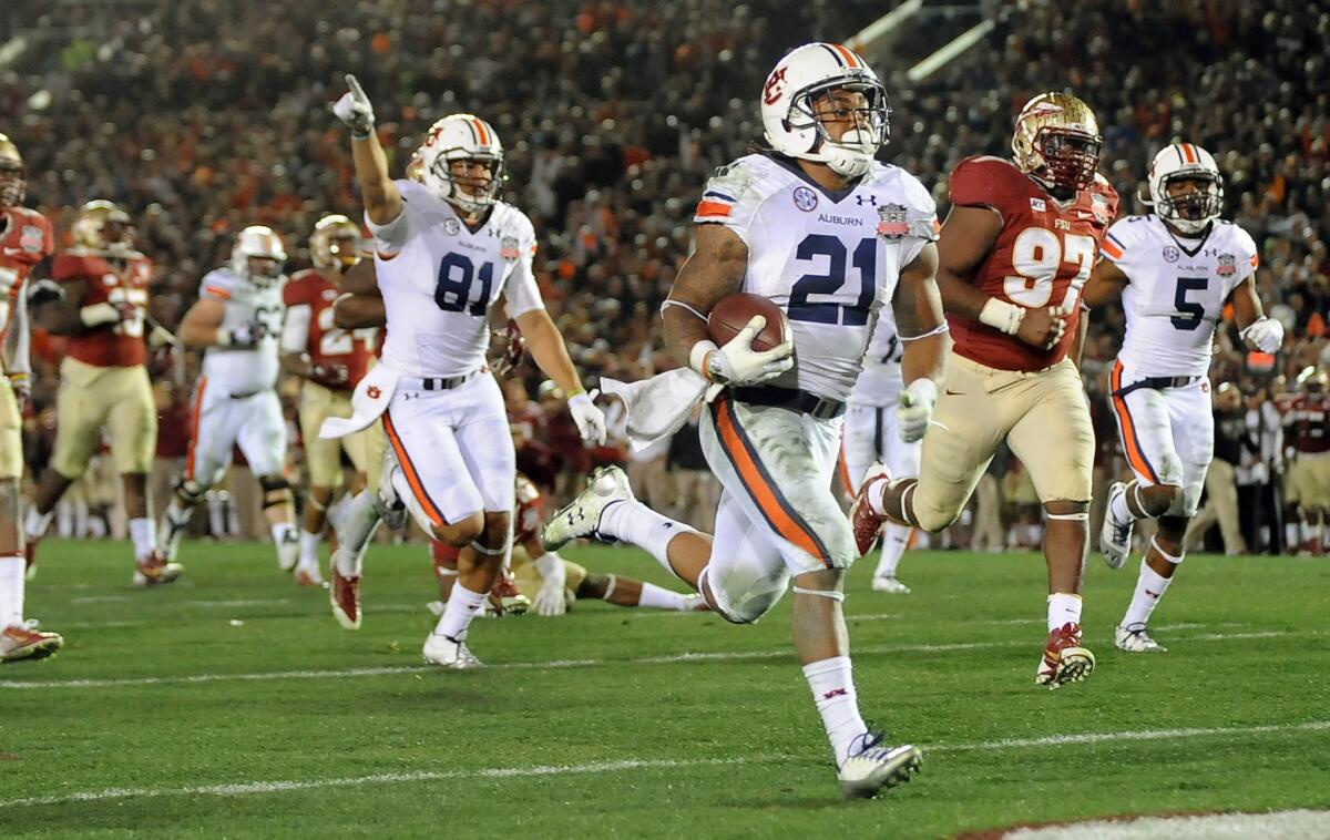 Auburn running back Tre Mason runs in for a touchdown against Florida State during the BCS Championship Game at the Rose Bowl on Jan. 4, 2014.