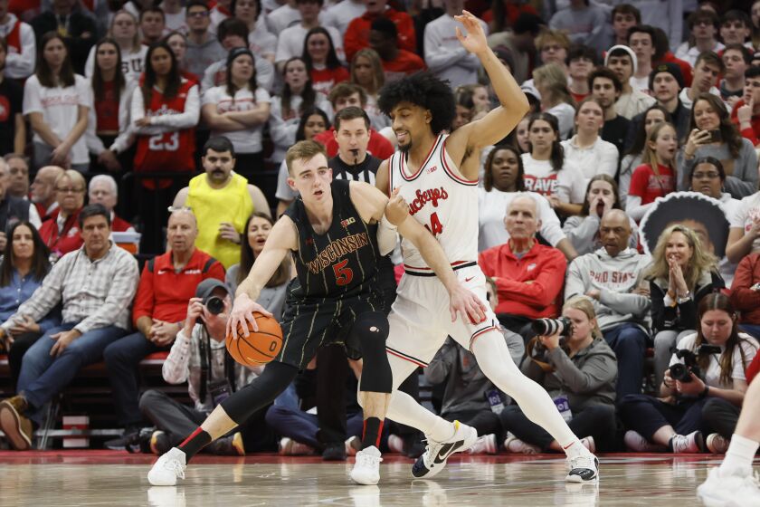 Wisconsin's Tyler Wahl, left, posts up against Ohio State's Justice Sueing during the second half of an NCAA college basketball game on Thursday, Feb. 2, 2023, in Columbus, Ohio. (AP Photo/Jay LaPrete)