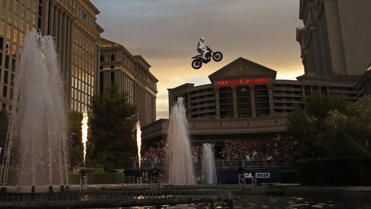 Travis Pastrana jumps the fountain at Caesars Palace on a motorcycle July 8 in Las Vegas.