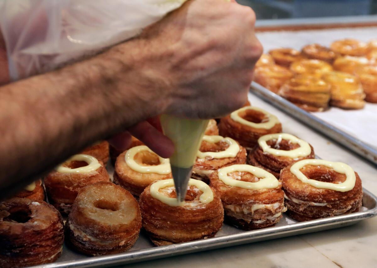 Chef Dominique Ansel makes Cronuts at the Dominique Ansel Bakery in New York.