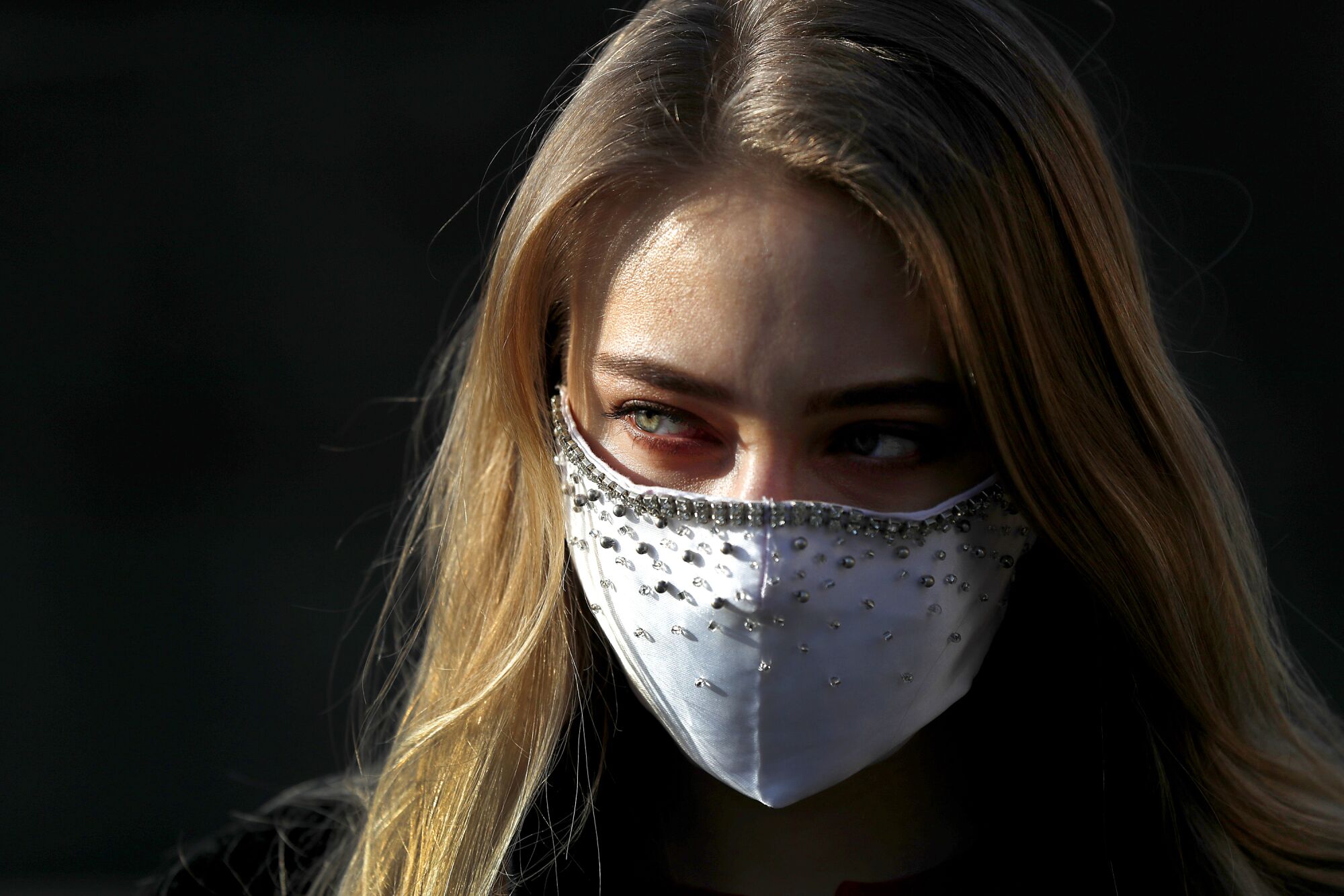 CZECH REPUBLIC: A woman wears a bedazzled face mask in downtown Prague.