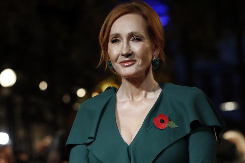 Writer J.K. Rowling poses at the world premiere of the film "Fantastic Beasts: The Crimes of Grindelwald" in Paris, Thursday, Nov. 8, 2018. (AP Photo/Christophe Ena)