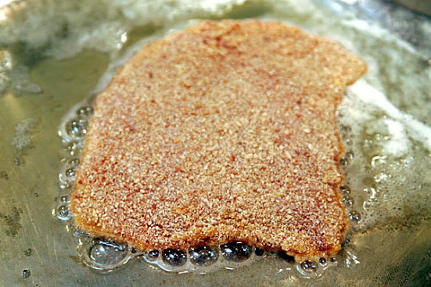 EASY ENTREE: The key to a good schnitzel  pork cutlet dipped in flour, egg and bread crumbs  is in the frying.