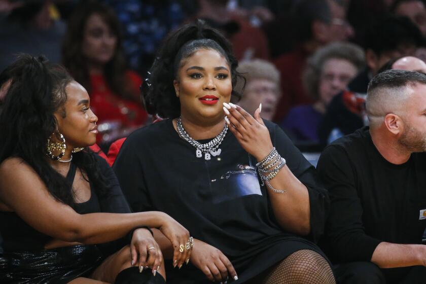 Singer Lizzo attends an NBA basketball game between Los Angeles Lakers and Minnesota Timberwolves, Sunday, Dec. 8, 2019, in Los Angeles. The Lakers won 142-125. (AP Photo/Ringo H.W. Chiu)