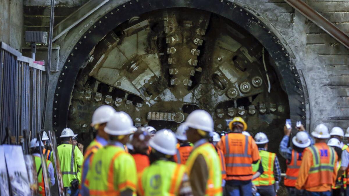 A tunnel-boring machine breaks through at the site of Leimert Park Station.