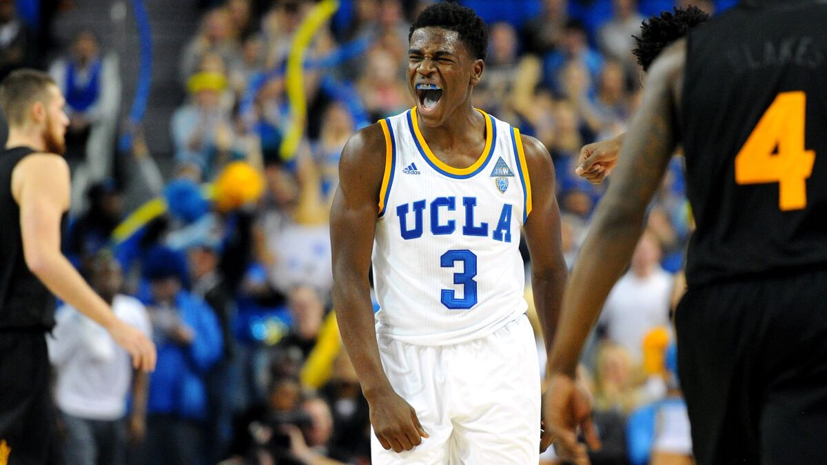 UCLA guard Aaron Holiday reacts after making a three-point shot in the final minute of an 81-74 victory over Arizona State on Saturday.