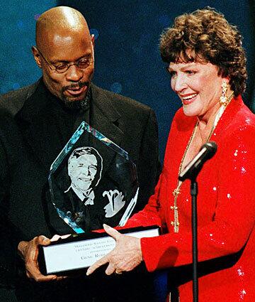 Majel Barrett Roddenberry accepts the Easter Seals Hollywood Lifetime Achievement Award given posthumously to her late husband, Gene Roddenberry. Avery Brooks from "Star Trek: Deep Space Nine" presented the award.