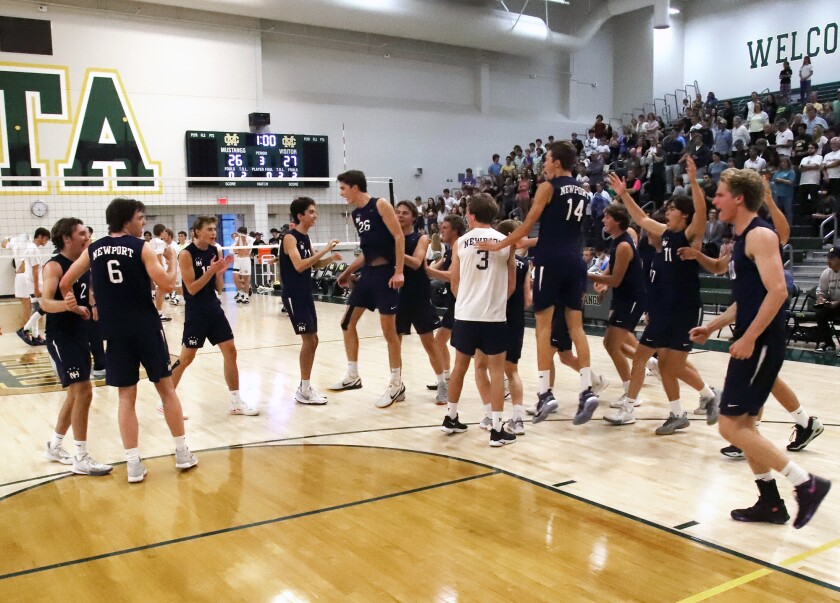 The Newport Harbor boys' volleyball team celebrates its win at Mira Costa in the semifinals on Saturday.