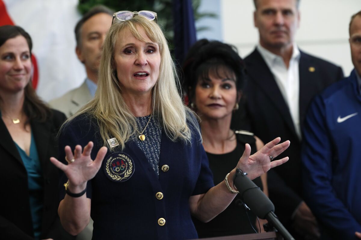 Nancy Hogshead-Makar, a former Olympic swimmer, believes college administrators are dodging Title IX mandates by squeezing too many female athletes into a limited number of sports.