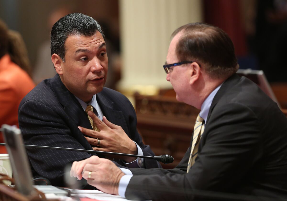 State Sen Alex Padilla (D-Los Angeles), left, talks to Senate Minority Leader Bob Huff (R-Diamond Bar), who on Monday dropped his opposition to a Padilla bill that puts a blackout period on campaign fundraising.