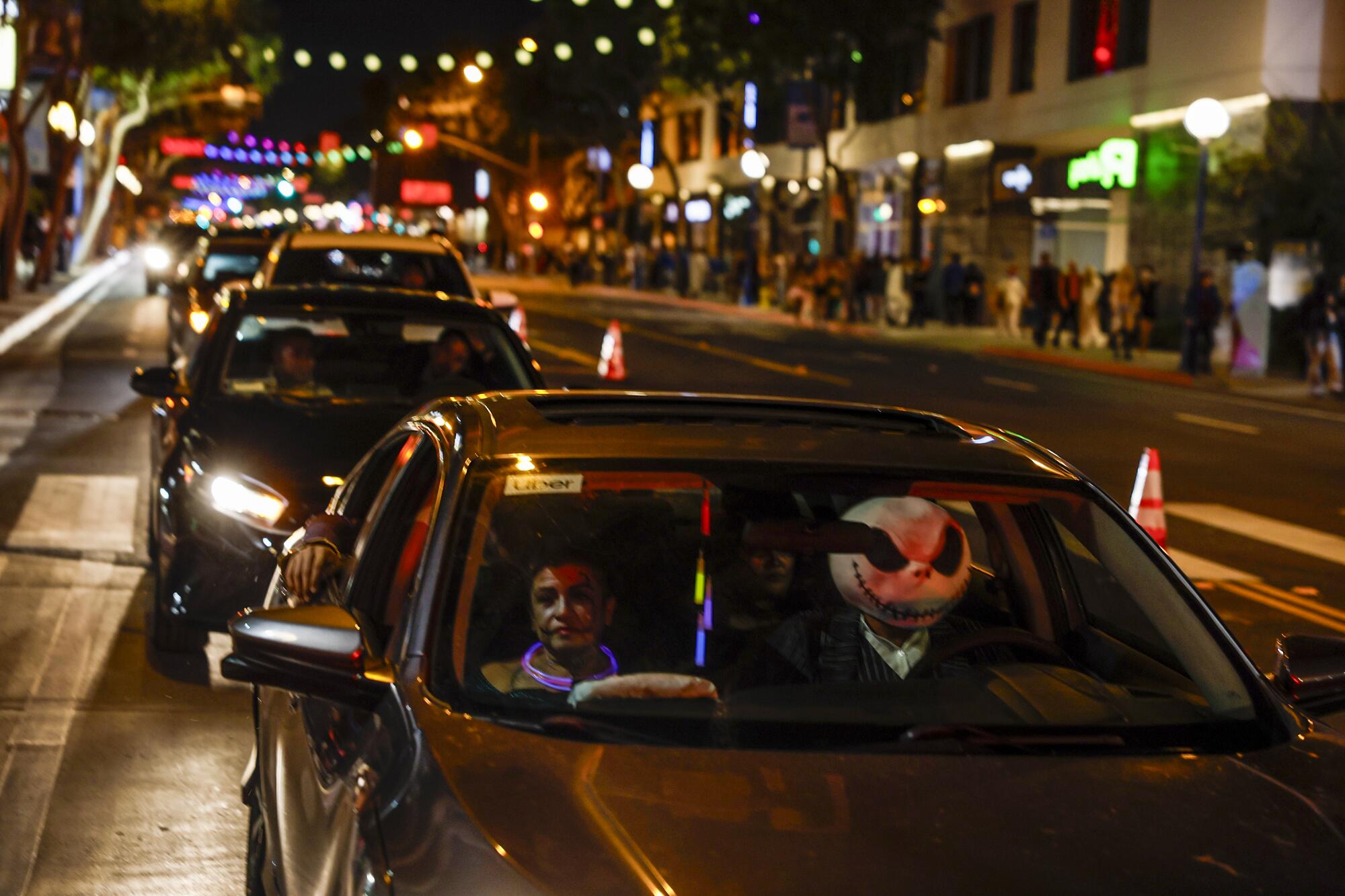 An Uber driver dressed as Jack Skellington sits in traffic on Santa Monica Boulevard. 