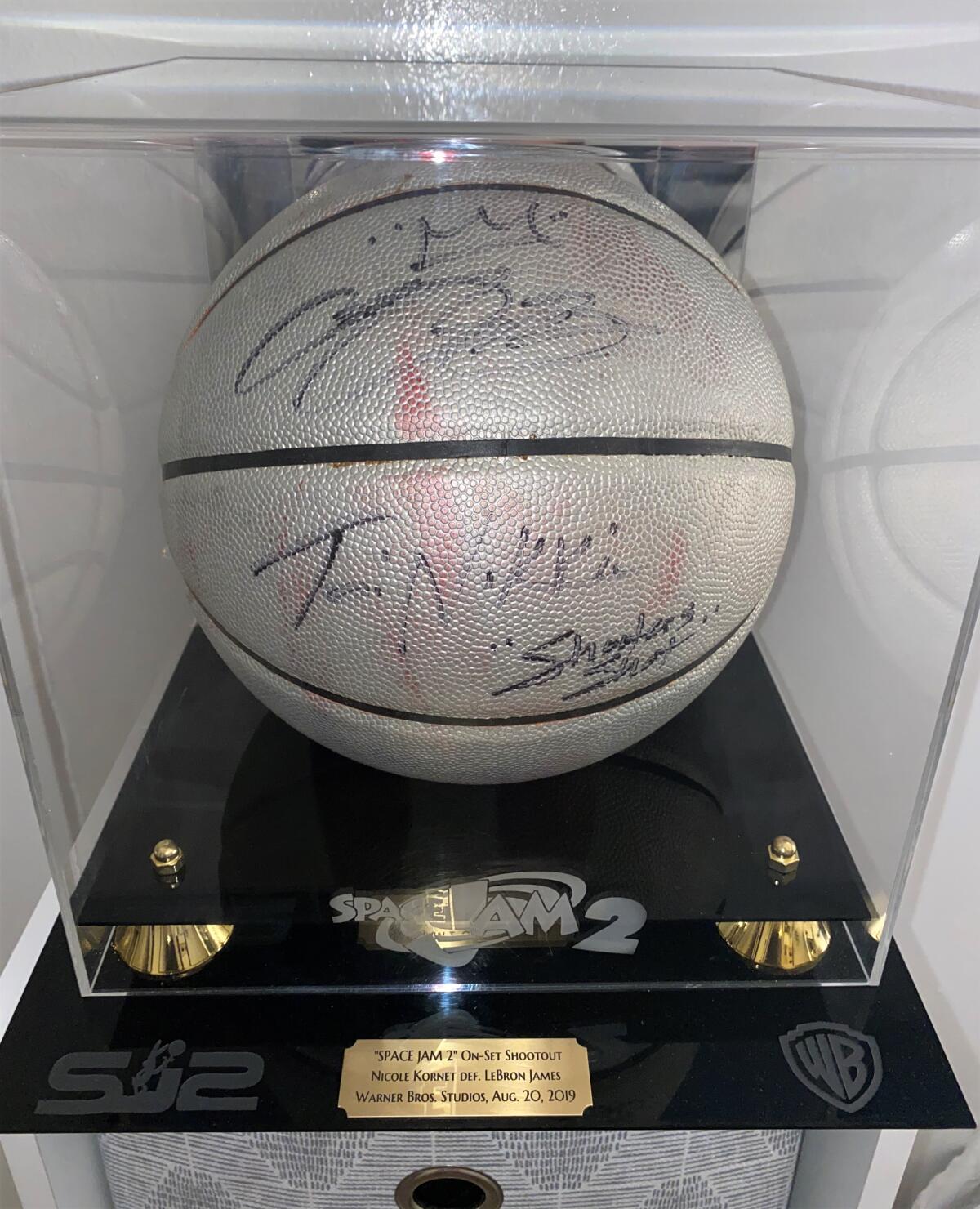 The ball Nicole Kornet won, signed by LeBron James, after she beat him in an on-set shooting competition.
