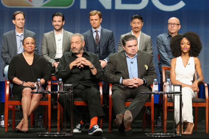 Back from left, "Chicago Med" Executive Producer Andrew Dettmann, actors Colin Donnell, Nick Gehlfuss and Brian Tee and Executive Producer Matt Olmstead join, front from left, actress S. Epatha Merkerson, Executive Producer Dick Wolf, actor Oliver Platt and actress Yaya DaCosta at the NBCUniversal portion of the 2015 Television Critics Assn. media tour in Beverly Hills on Thursday.