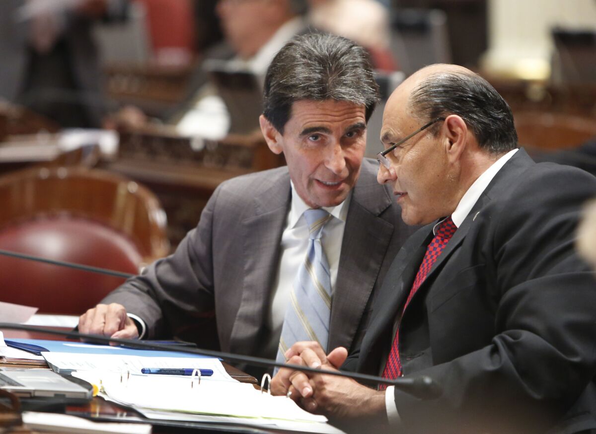 Mark Leno, left, talks with Lou Correa at the Capitol when both men served in the state Senate. Leno twice proposed police transparency bills that failed when police unions opposed them.