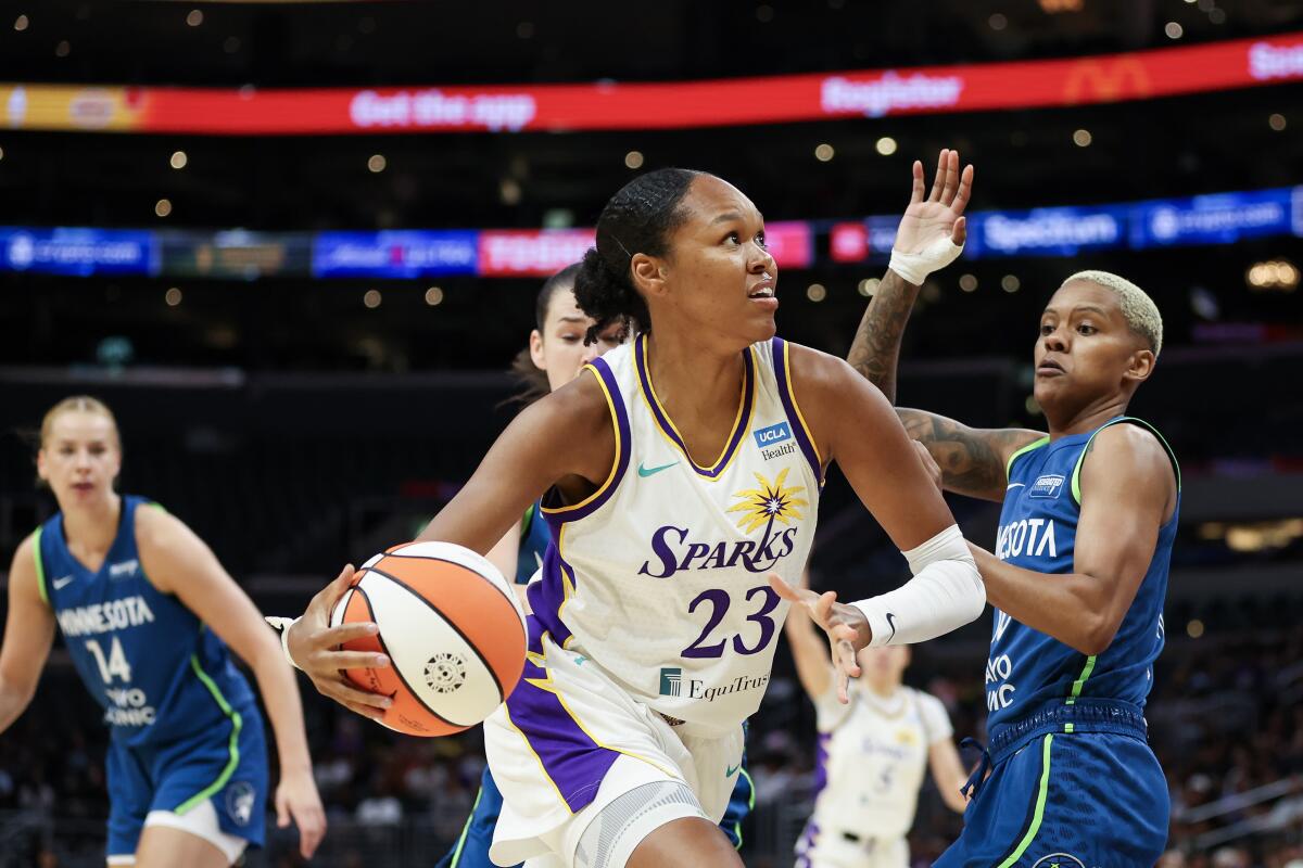 Sparks forward Azurá Stevens drives toward the basket against the Minnesota Lynx