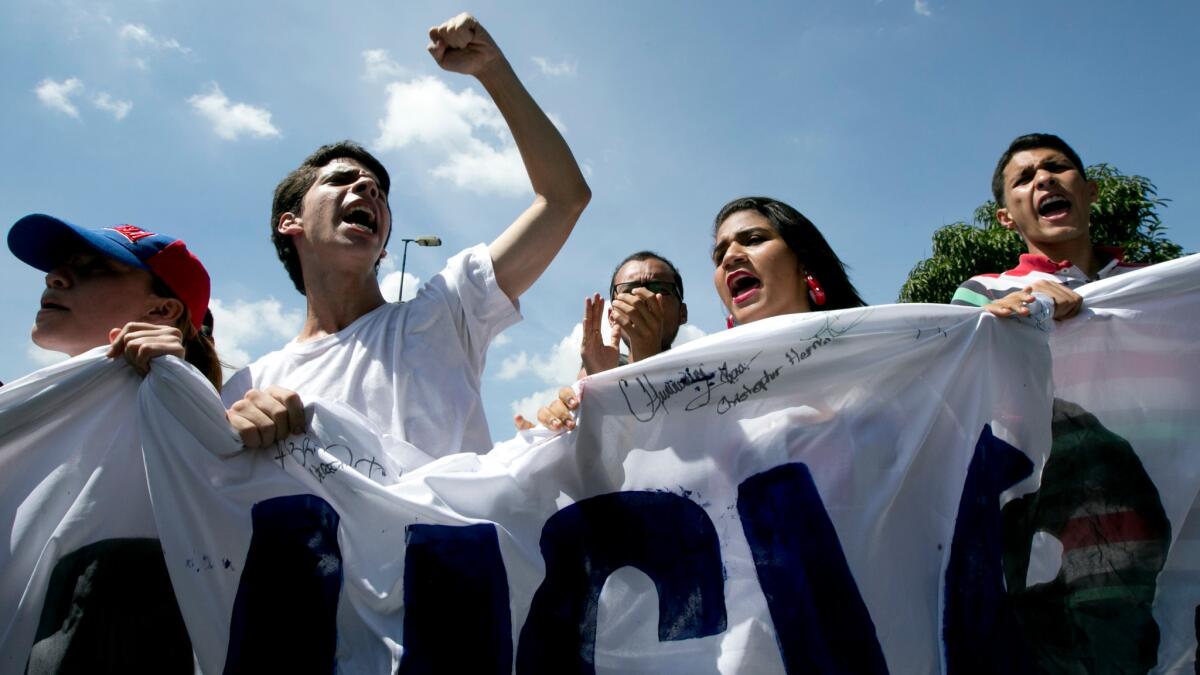 Students in Caracas on Friday demand a recall referendum to oust embattled Venezuelan President Nicolas Maduro.