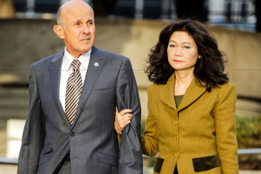 Former Los Angeles County Sheriff Lee Baca and his wife, Carol Chiang, arrive at the federal courthouse in downtown Los Angeles this month for his trial on charges of conspiracy and obstruction of justice.