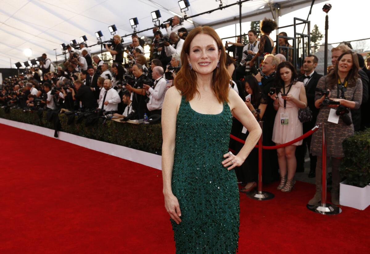 Julianne Moore on the red carpet at the 21st Screen Actors Guild Awards at the Shrine Auditorium in Los Angeles on Sunday, before she won for lead actress in "Still Alice."