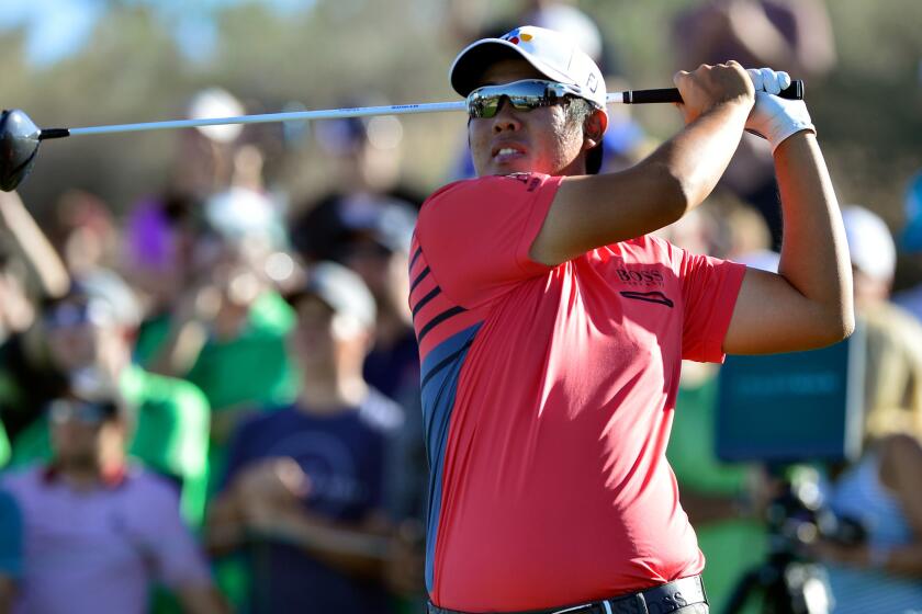 Byeong Hun An follows through on his tee shot at No. 18 during the third round of the Waste Management Phoenix Open.