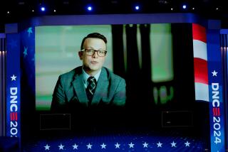 DNC CHICAGO, IL AUGUST 21, 2024 - Student Jacob Reitan is shown on a large screen during a short video highlighting Governor Walz's service in the National Guard and as a teacher at the Democratic National Convention Wednesday, Aug. 21, 2024, in Chicago, IL. (Myung J. Chun/Los Angeles Times)