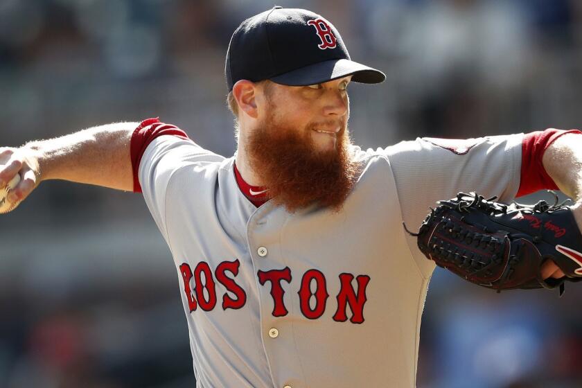 FILE - In this Sept. 3, 2018, file photo, Boston Red Sox relief pitcher Craig Kimbrel works against the Atlanta Braves in the ninth inning of baseball game, in Atlanta. Pitchers Dallas Keuchel and Craig Kimbrel, the last two top free agents on the market, can sign starting Monday, June 3, 2019, with their new teams having to forfeit amateur draft picks as compensation. Both turned down $17.9 million qualifying offers in November, Keuchel from Houston and Kimbrel from the World Series champion Boston Red Sox. (AP Photo/John Bazemore, File)