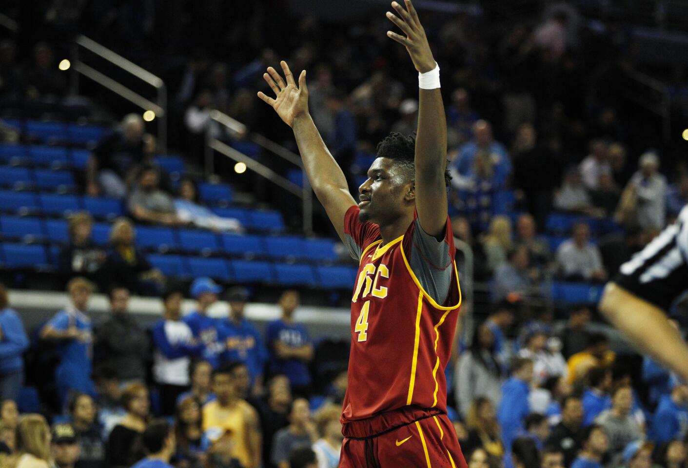 USC forward Chimezie Metu (4) celebrates after an 89-75 victory over UCLA on Wednesday night at Pauley Pavilion.