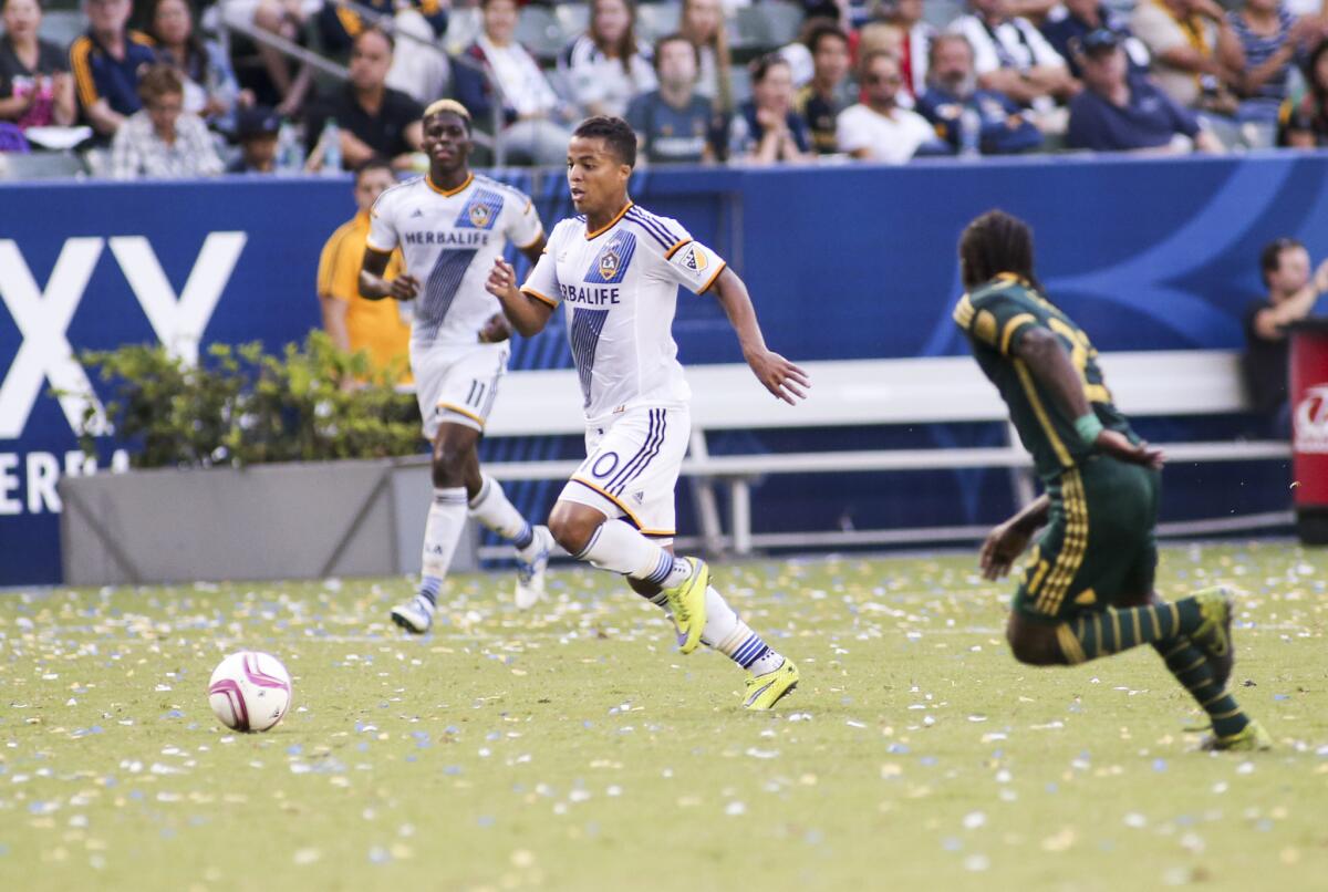 Galaxy forward Giovani dos Santos (10) runs with the ball during a game against the Portland Timbers on Oct. 18.