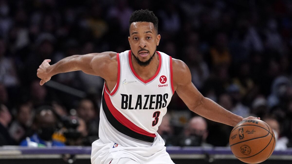 Portland Trail Blazers guard C.J. McCollum dribbles up court.