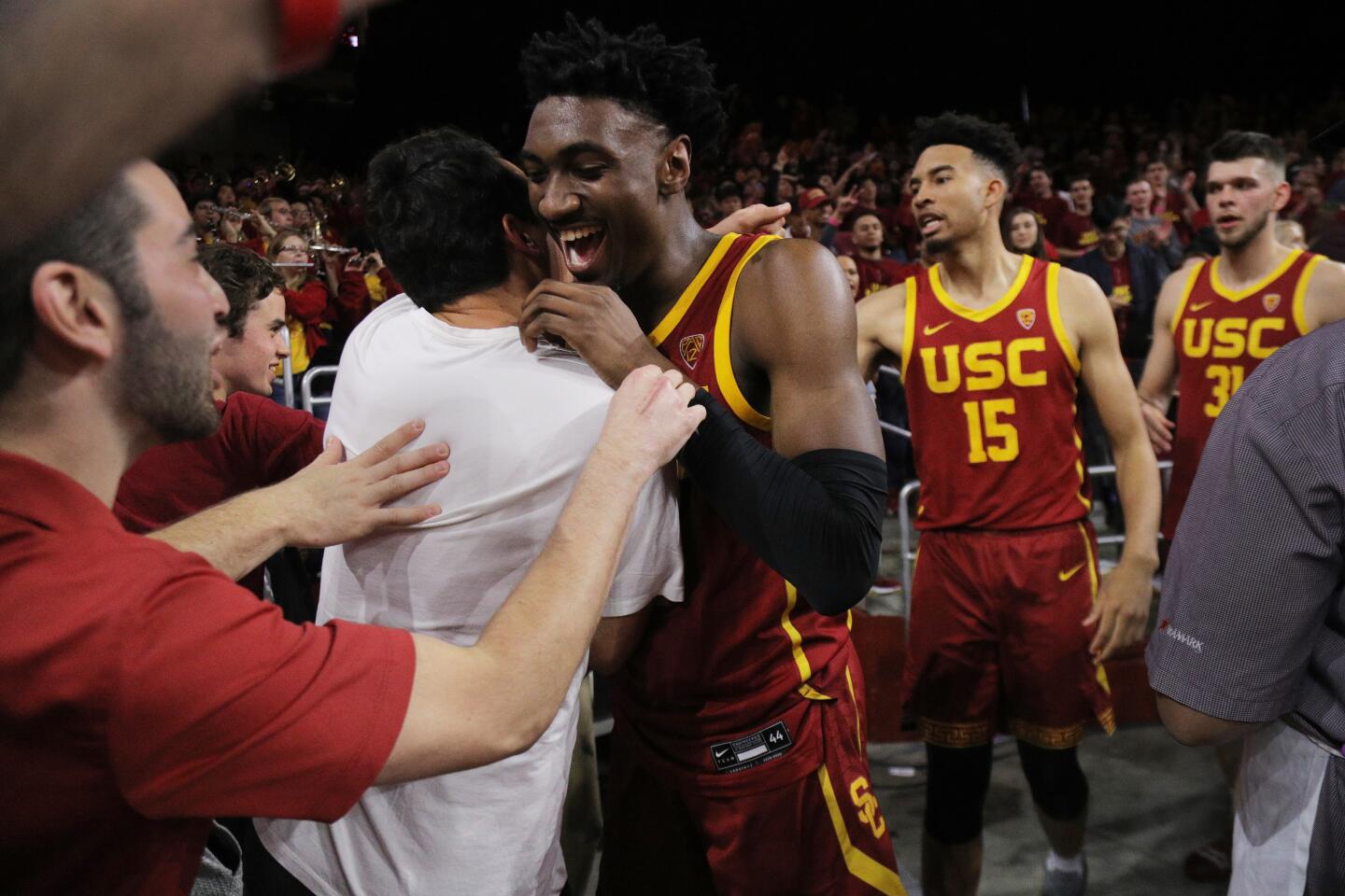 USC guard Jonah Mathews celebrates with fans after scoring the winning basket at the end of the Trojans' 54-52 victory over UCLA at Galen Center on March 7, 2020.