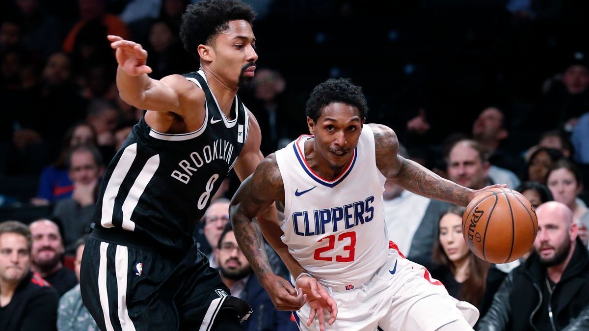 Brooklyn Nets guard Spencer Dinwiddie, left, defends against Los Angeles Clippers guard Lou Williams during the first half of an NBA basketball game on Feb. 12 in New York.