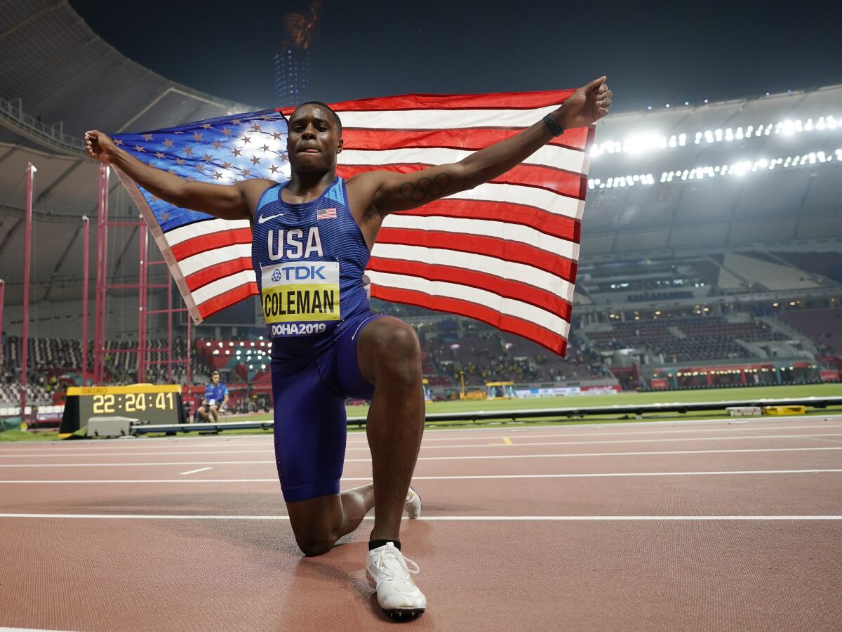 U.S. sprinter Christian Coleman celebrates after winning the men's 100 meters at the World Athletics Championships in 2019.