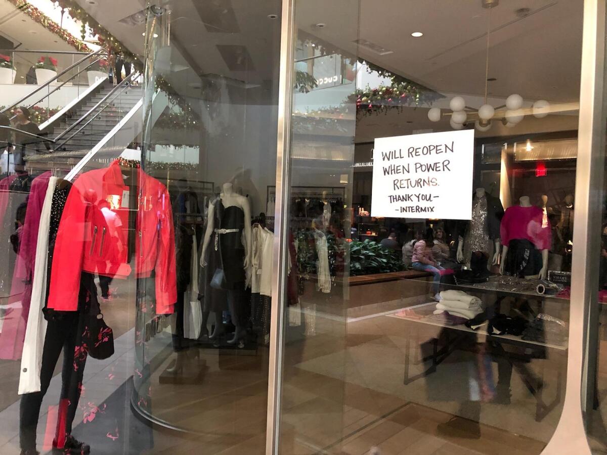 A power outage at South Coast Plaza left some storefronts darkened Friday afternoon.