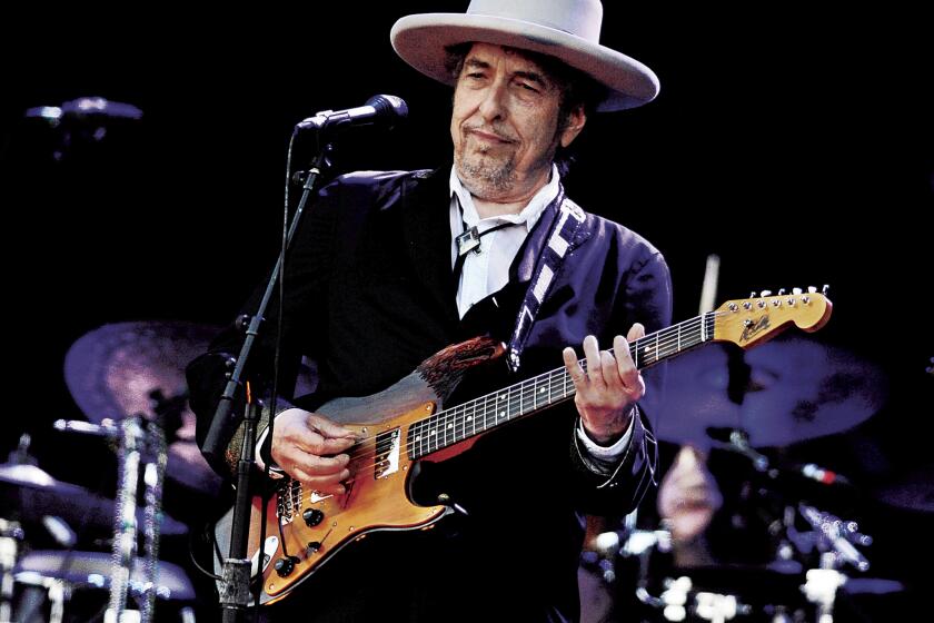 A 2012 file photo shows Bob Dylan performing in France. Dylan refused to allow photographs at his show Saturday with Mavis Staples at the Santa Barbara Bowl, part of a tour that reaches the Shrine Auditorium in Los Angeles on Thursday.
