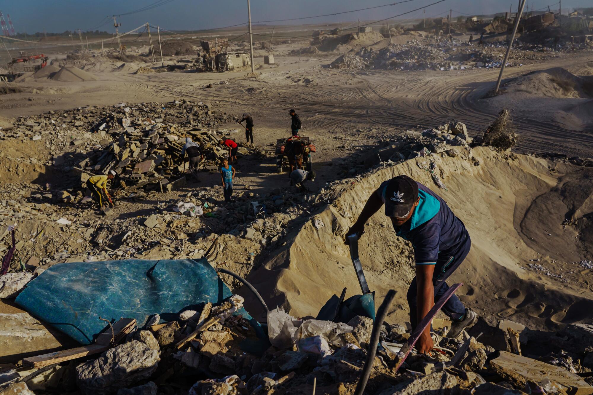  Man sorts rubble in the Gaza Strip  