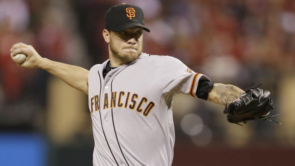 San Francisco Giants starter Jake Peavy delivers a pitch during Game 2 of the National League Championship Series against the St. Louis Cardinals on Oct. 12.