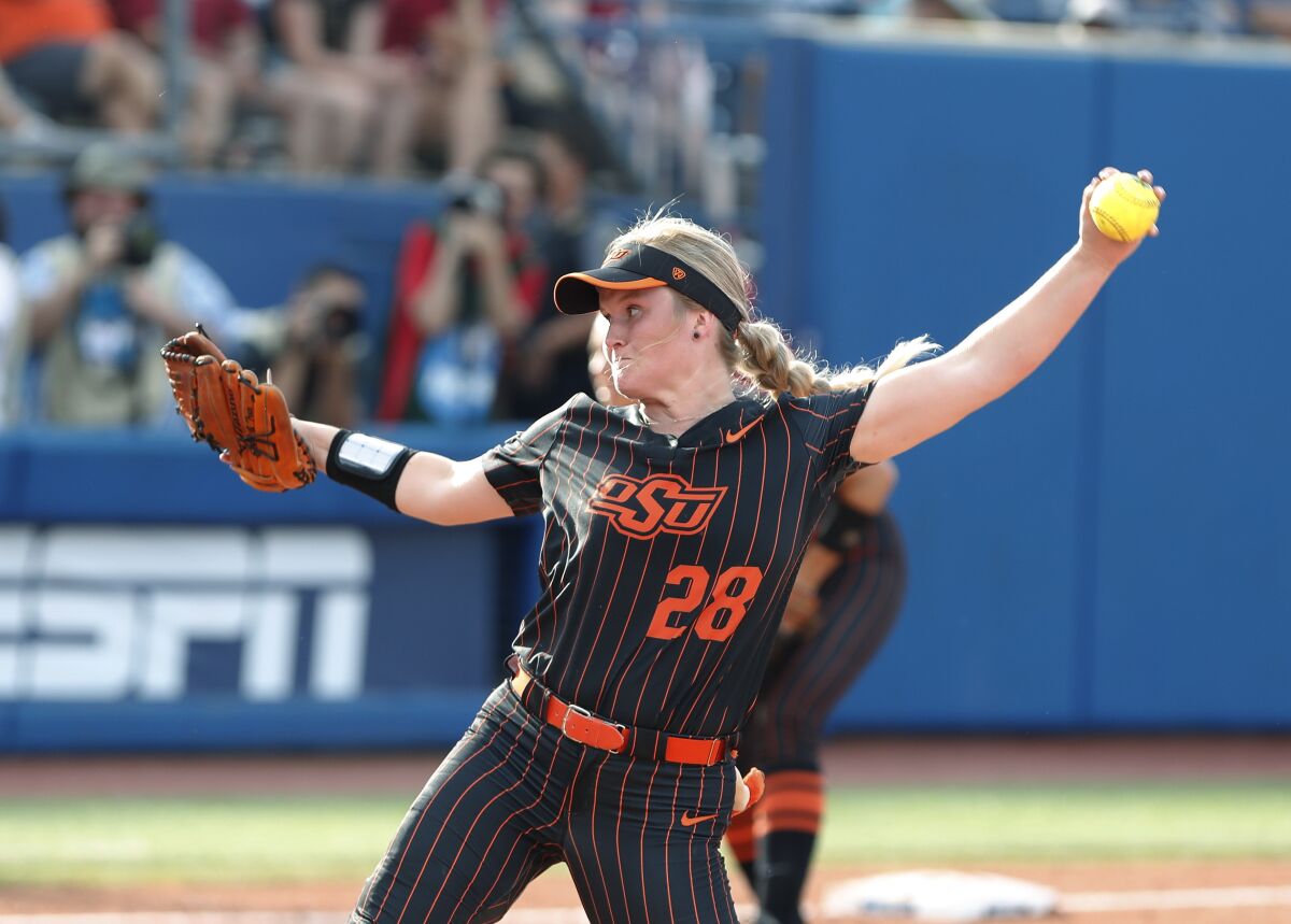 Oklahoma State's Kelly Maxwell pitches in the second inning of the team's NCAA softball Women's College World Series game against Florida on Saturday, June 4, 2022, in Oklahoma City. (AP Photo/Alonzo Adams)