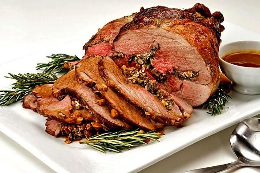 Lamb is stuffed with greens, feta and pine nuts.