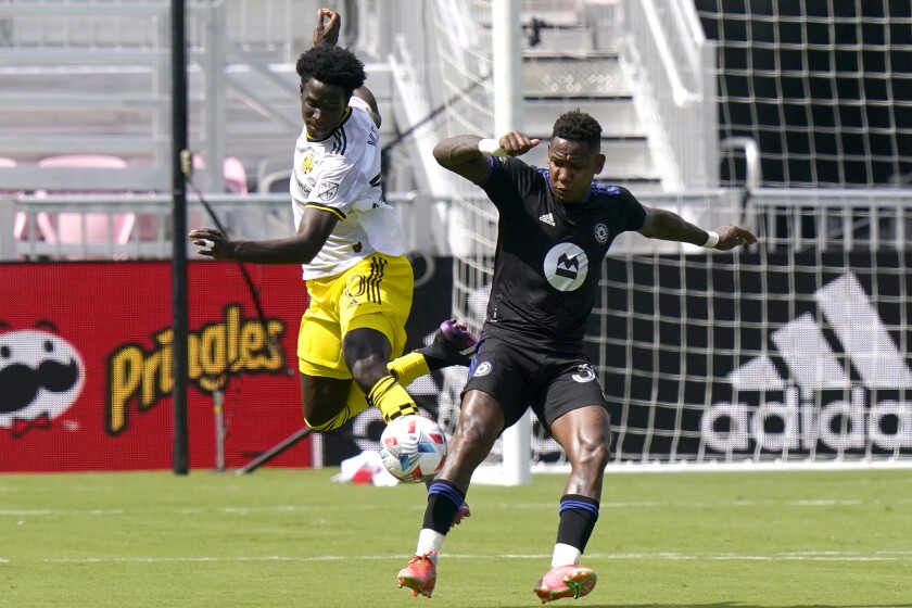 Columbus Crew defender Aboubacar Keita, left, and CF Montréal forward Romell Quioto, right, go for the ball during the first half of an MLS soccer match, Saturday, May 1, 2021, in Fort Lauderdale, Fla. (AP Photo/Lynne Sladky)