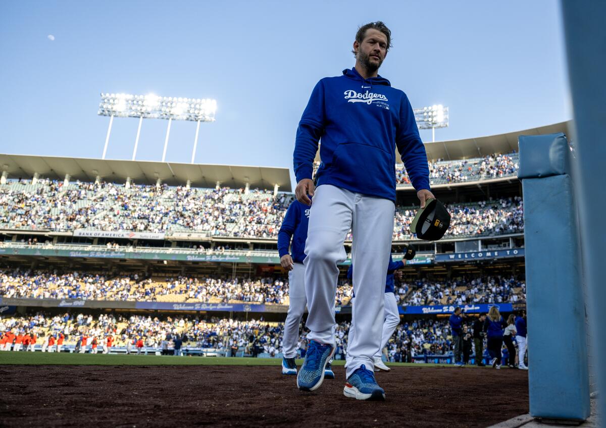 Dodgers pitcher Clayton Kershaw walks back to the dugout before a game against the Cincinnati Reds on May 18.