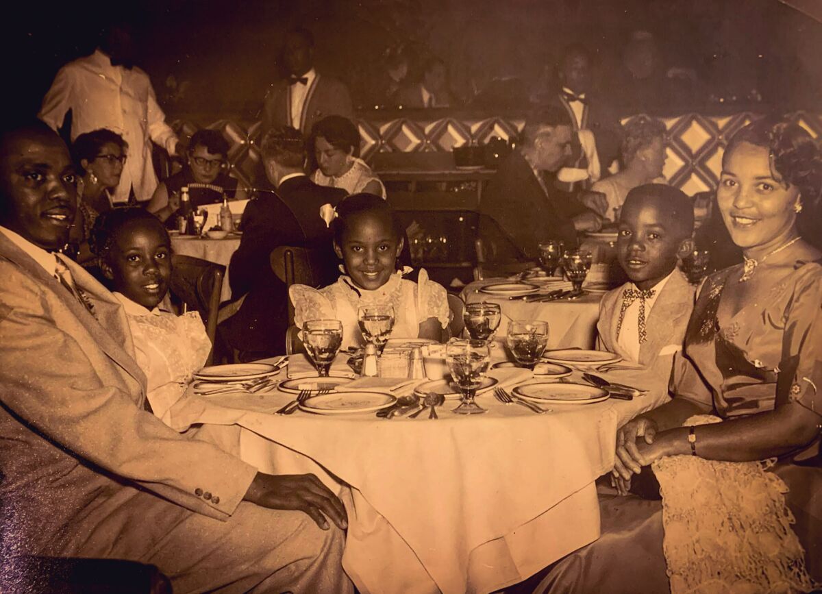 Wendy Shelton's father, Odell Nichols Jr., as a boy, dining with family at Las Vegas' Moulin Rouge in 1955.