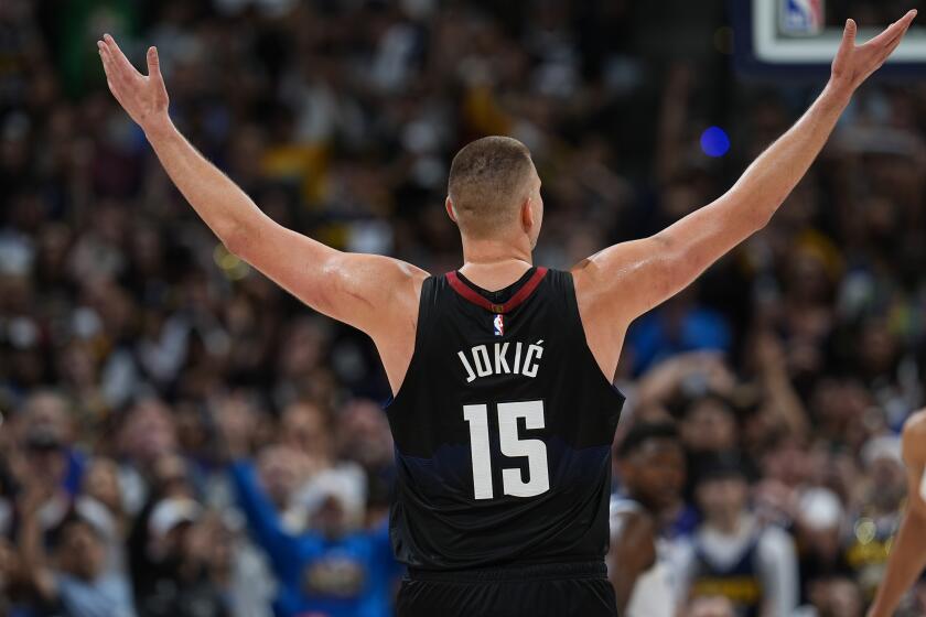 Denver Nuggets center Nikola Jokic gestures after guard Jamal Murray hit a basket against the Minnesota Timberwolves late in the second half of Game 5 of an NBA basketball second-round playoff series Tuesday, May 14, 2024, in Denver (AP Photo/David Zalubowski)