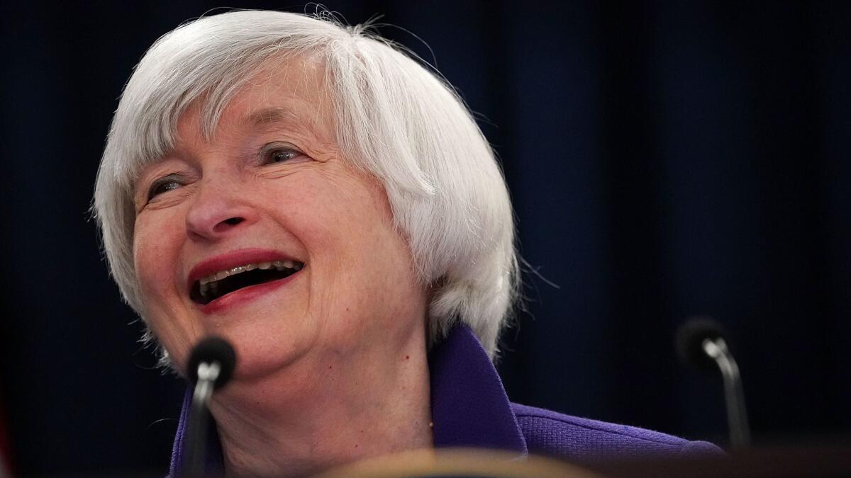 Federal Reserve Chairwoman Janet L. Yellen laughs Wednesday during her final news conference as central bank chief in Washington, D.C.