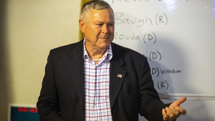 A new poll finds that GOP Rep. Dana Rohrabacher, pictured on primary night, is essentially tied with Democrat Harley Rouda in the heated race for the lawmaker's coastal Orange County district.