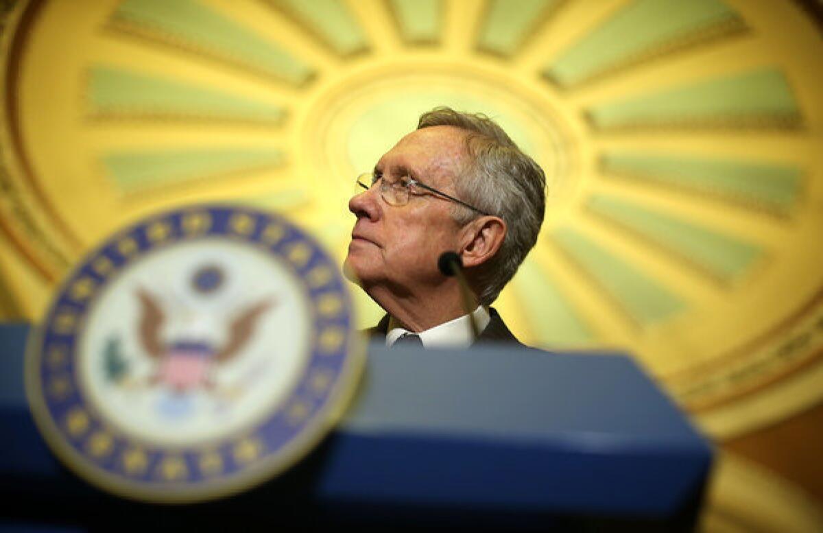 Senate Majority Leader Harry Reid (D-Nev.) speaks to members of the media during a news briefing on Capitol Hill.
