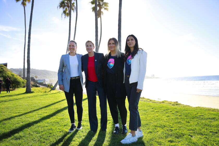 SAN DIEGO, CA - DECEMBER 15: San Diego Wave FC coach Casey Stoney, left, president Jill Ellis, and players Abby Dahlkemper and Alex Morgan attend a colors & crest event on Wednesday, Dec. 15, 2021 in San Diego. (K.C. Alfred / The San Diego Union-Tribune)