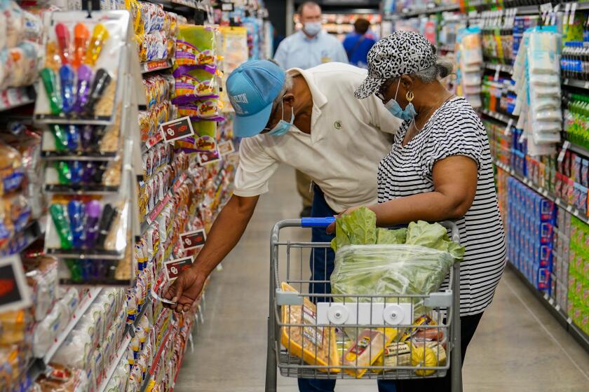 Consumers shopping at a grocery store